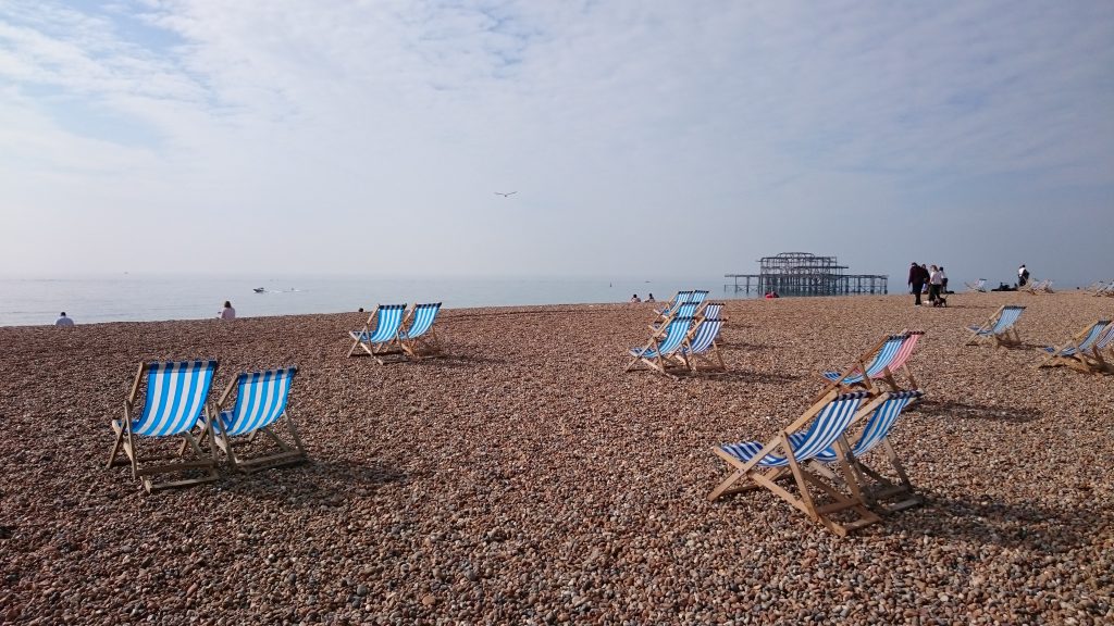 Beach chairs on Brighton beach, just 40 minutes away from The Green